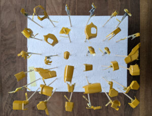 Sinanju Stein model kit pieces primed with Instacoll base yellow.