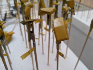 Close-up of Sinanju Stein model kit pieces primed with Instacoll base yellow.